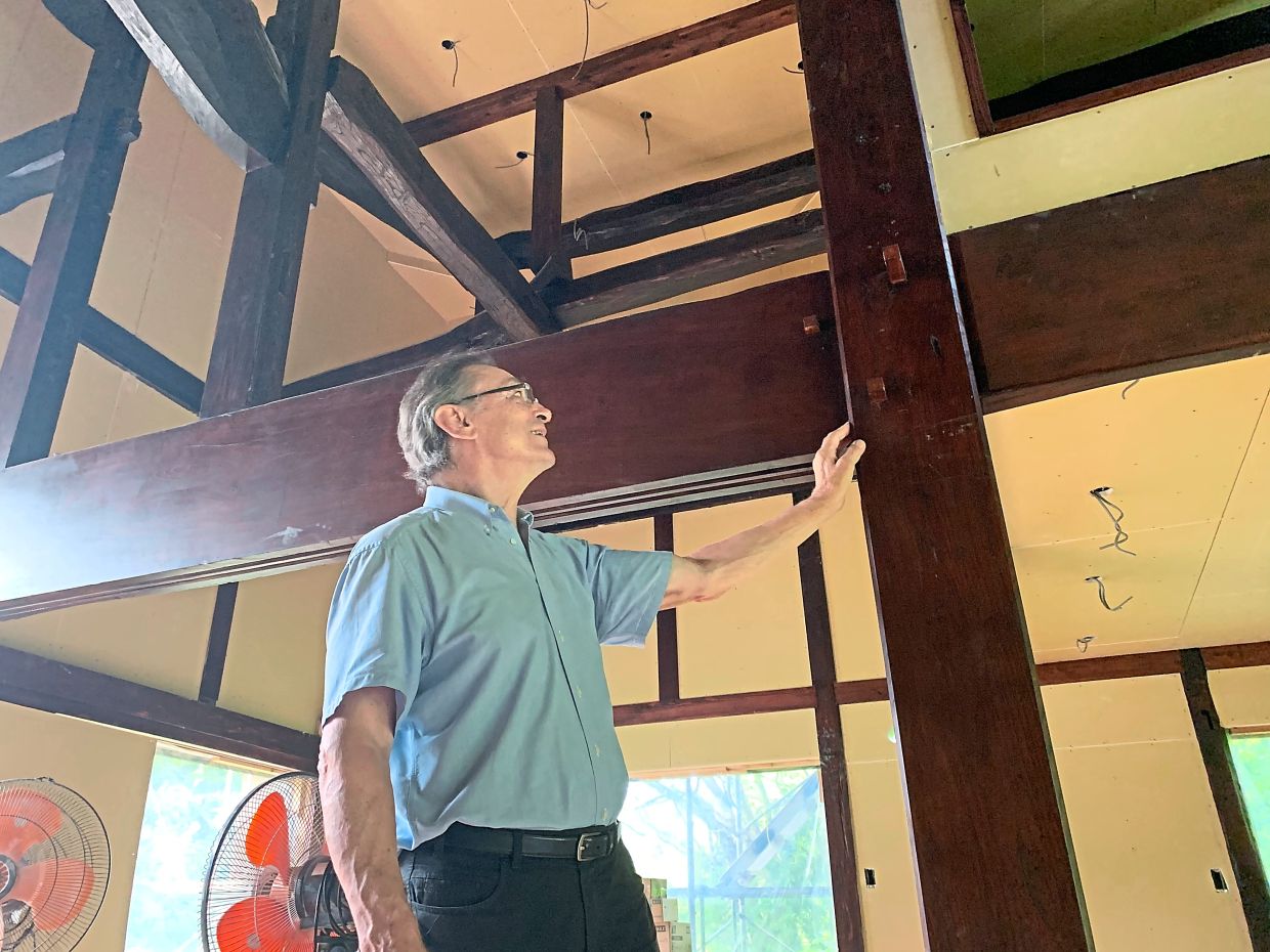 PRODUCTION - German architect Karl Bengs stands next to support beams from an old Kominka, a traditional Japanese country house, which he is using to build a new house for a client. The beams are inserted into each other according to a traditional building method, without the need for nails or screws. Photo: Lars Nicolaysen/dpa